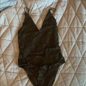 Deep v. Lace black body suit.